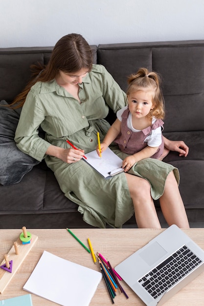 High angle mother and kid on couch