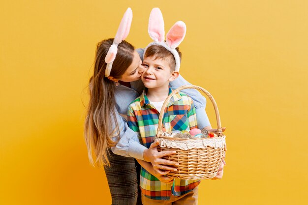 High angle mother and son with basket of painted eggs