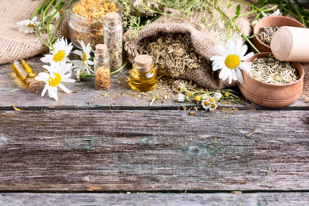 Free photo high angle of natural medicine on wooden table