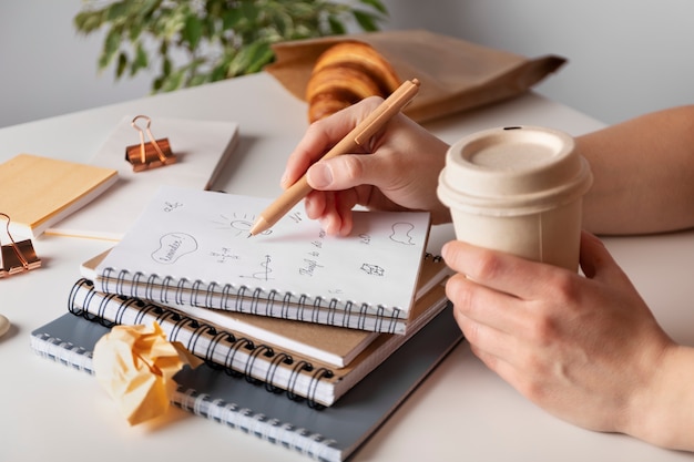 High angle notebooks and croissant arrangement