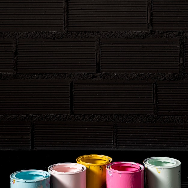 Free photo high angle of paint cans with copy space