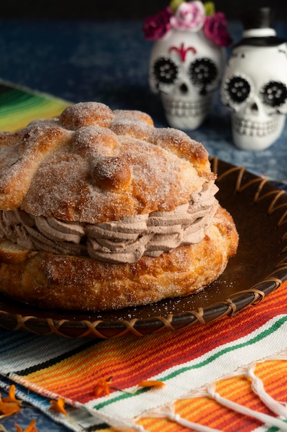 Free Photo high angle of pan de muerto with skulls