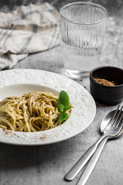 High angle pasta plate and cutlery