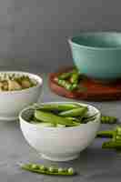 Free photo high angle pea pods in bowl