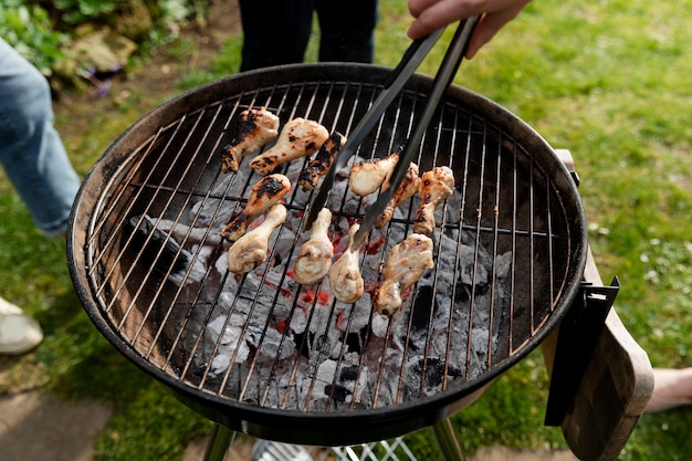 High angle people making barbecue