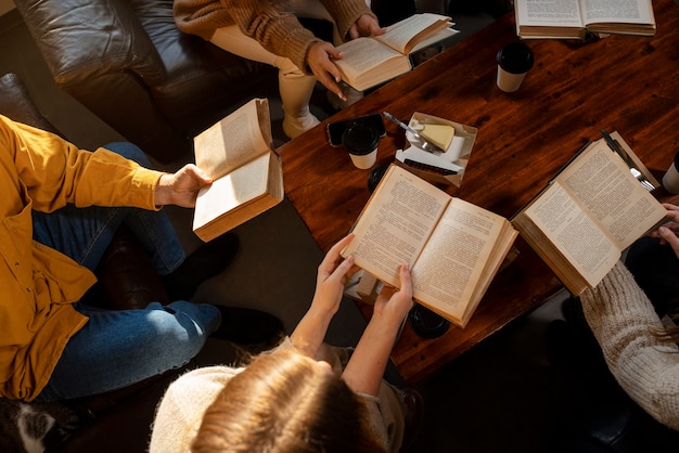 Free photo high angle people reading together