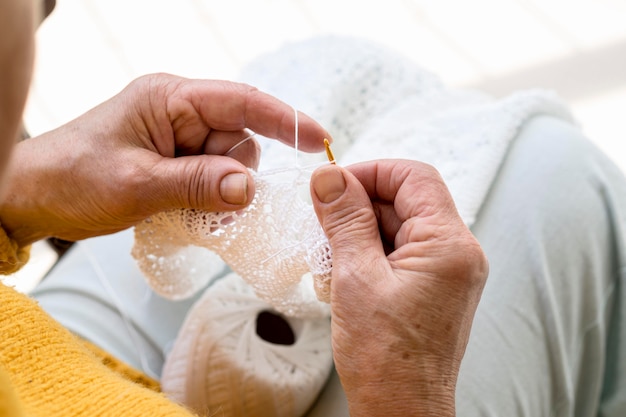 Free photo high angle of person crocheting something