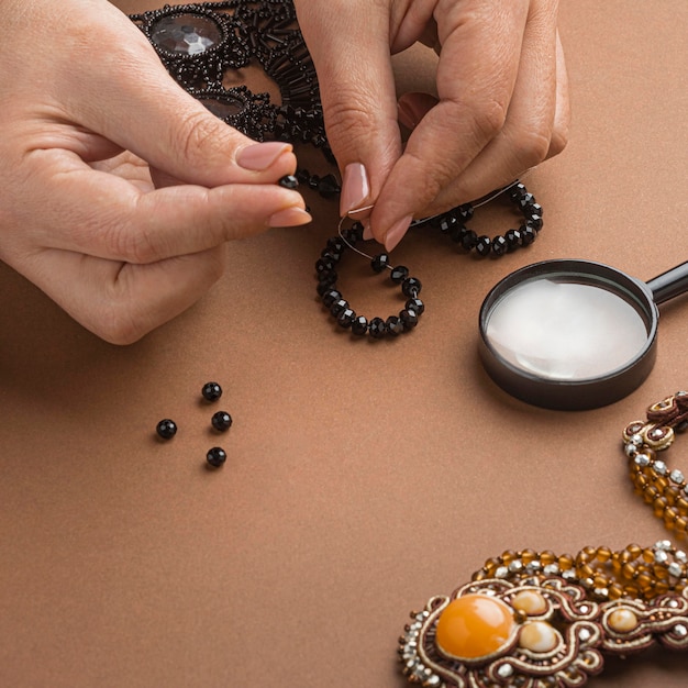 Free Photo high angle of person doing bead work