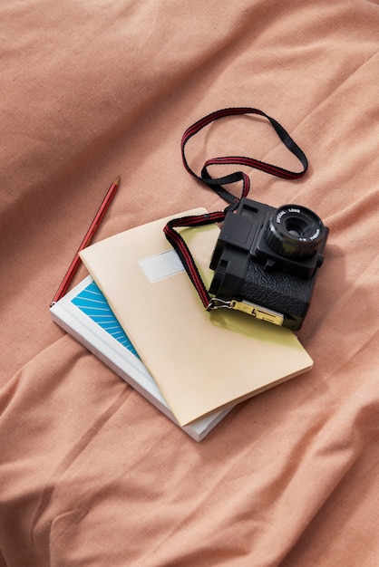 Free Photo high angle photo camera and notebook