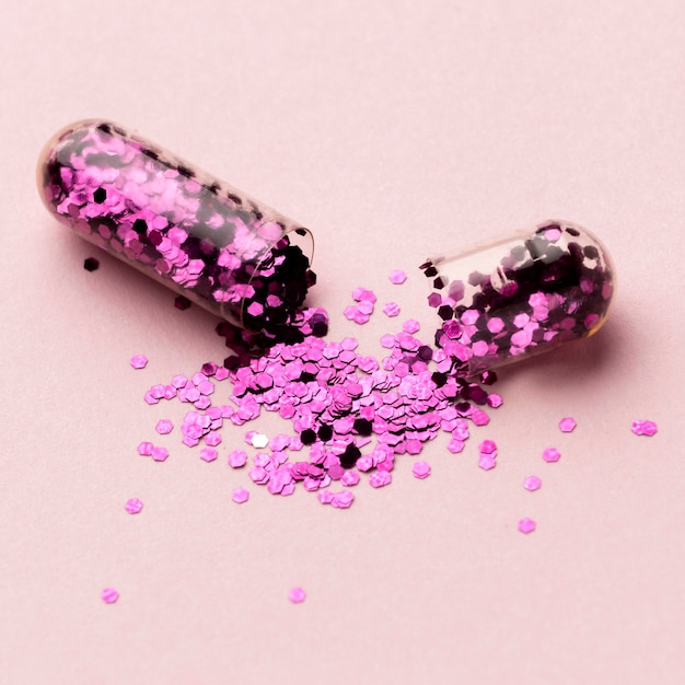 Free Photo high angle pill with glitter