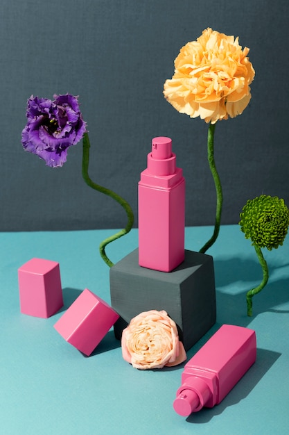 Free photo high angle pink cosmetic containers arrangement