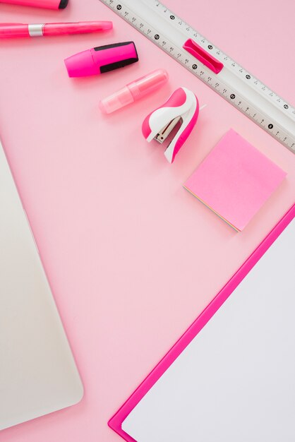 High angle pink items on desk