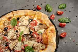 Free photo high angle of pizza on plain background