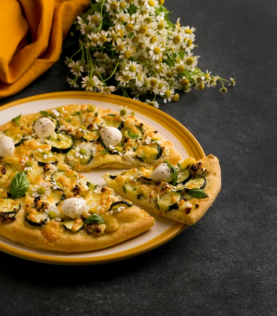 High angle of plate of pizza with flowers