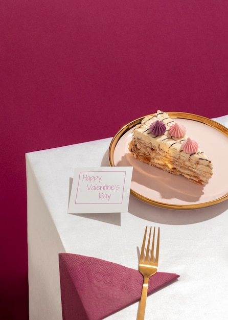 Free photo high angle of plate with slice of cake and fork for valentine's day