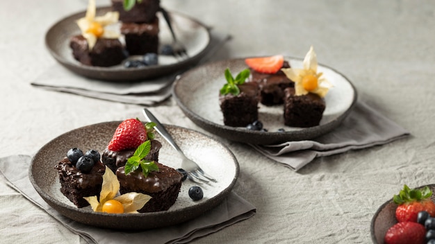 Free photo high angle of plates with desserts and fruits