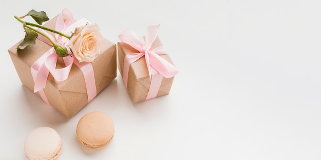 High angle of presents with copy space and macarons