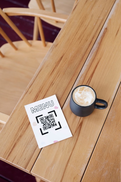 Free Photo high angle qr code note and coffee cup