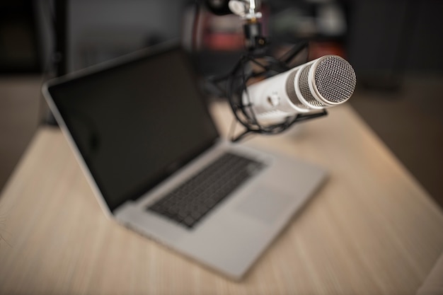 Free photo high angle of radio microphone and laptop