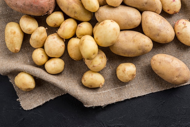 High angle raw potatoes on table