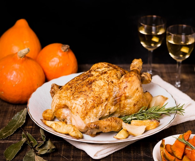 High angle of roasted chicken on plate for thanksgiving dinner