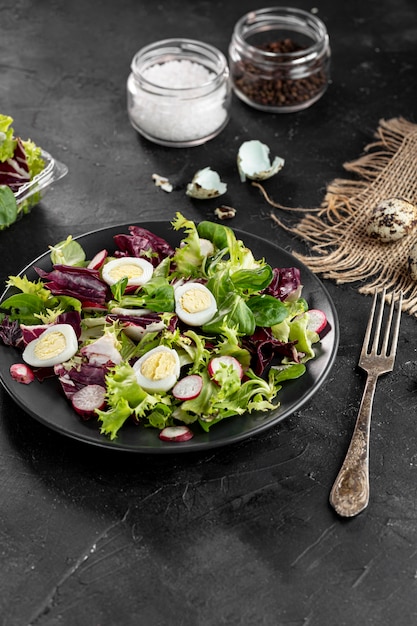 Free photo high angle salad arrangement on dark table