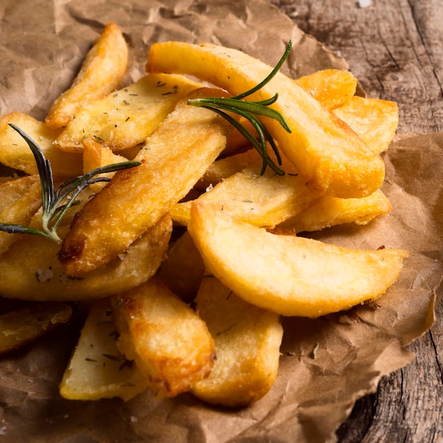 Free Photo high angle of salted french fries with herbs