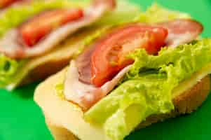 Free photo high angle sandwich arrangement on green board