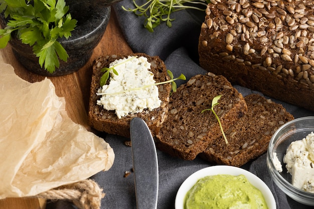 Free Photo high angle of sandwich with knife and herbs