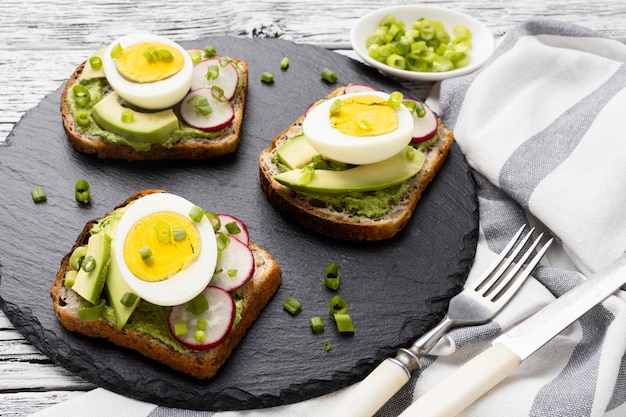 High angle of sandwiches with egg and avocado