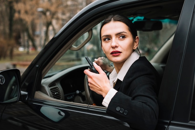 Free Photo high angle security woman in car