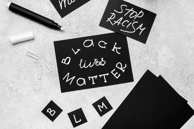 Free Photo high angle of selection of cards with black lives matter with pen