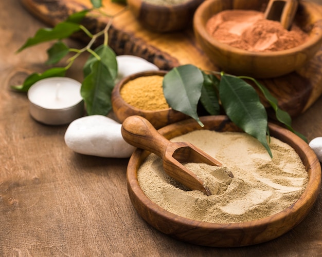 High angle of  selection of fine powders in bowls with leaves and stones