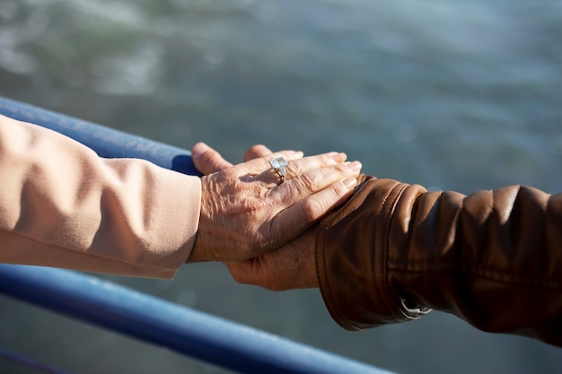 High angle of senior couple holding hands