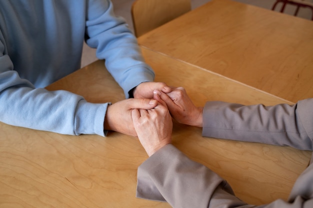 High angle senior couple holding hands