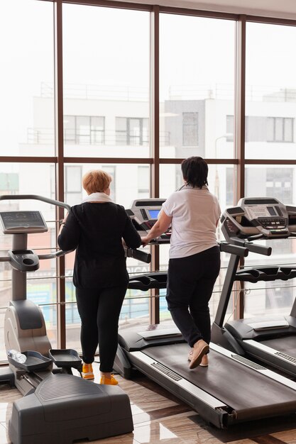 High angle senior couple on treadmill