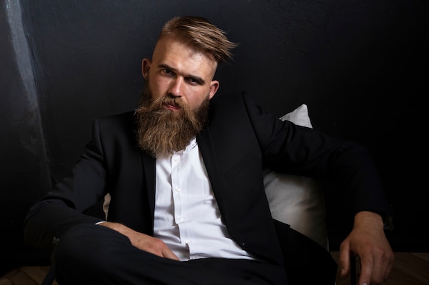 High angle sensitive man posing in studio