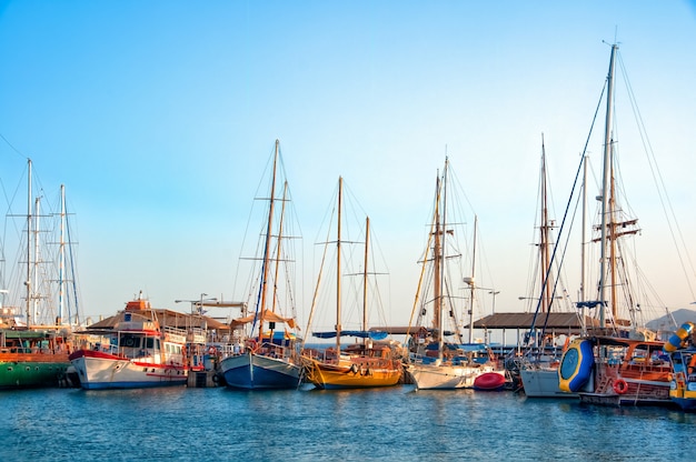 High angle shot of beautiful boats parked in the pure water during the daytime