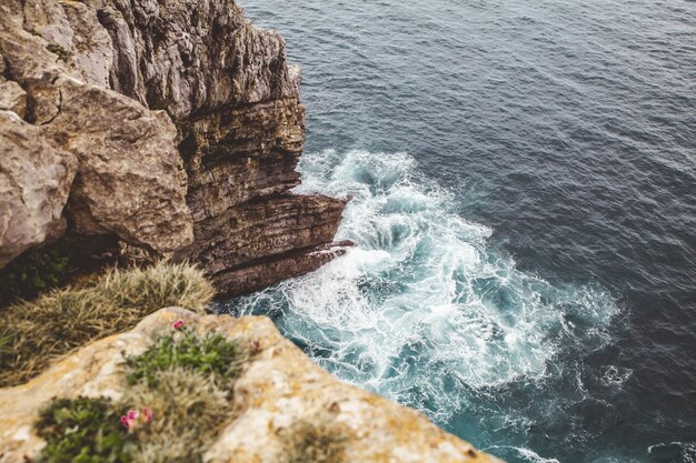 High angle shot of the blue sea and the coast