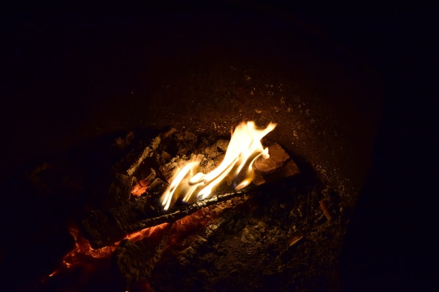 Free Photo high angle shot of a campfire on the ground in the night