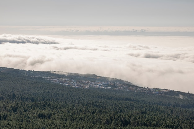 High angle shot clouds and mountain from above