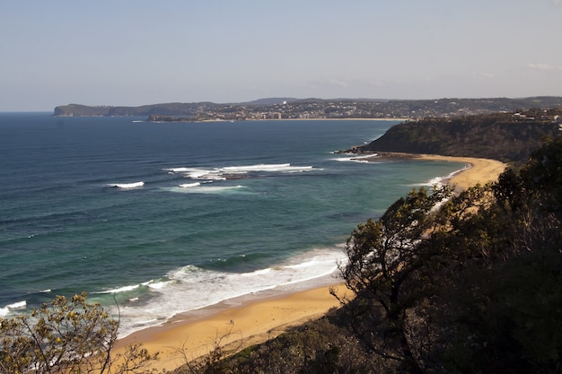 Free photo high angle shot of the coast of the ocean with a small sandy beach