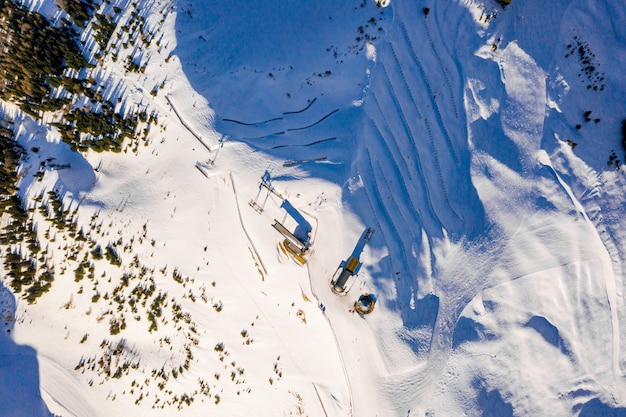 High angle shot of fantastic winter landscape of snowy mountains during a sunny cold day