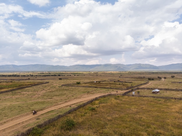 Free photo high angle shot of the farms with the mountains in the background captured in samburu, kenya