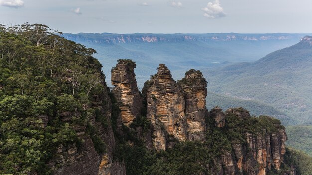 High angle shot of forested mountain under a cloudy sky