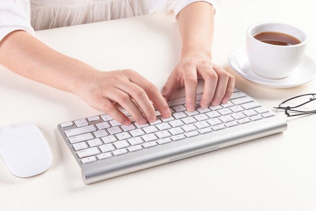 High angle shot of hands typing on a keyboard