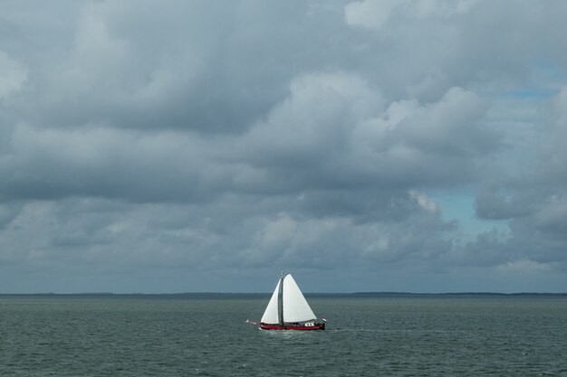 Free Photo high angle shot of a sailing boat in the sea