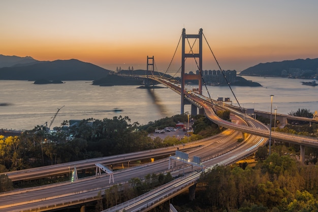 Free photo high angle shot of the tsing ma bridge captured at sunset in hong kong