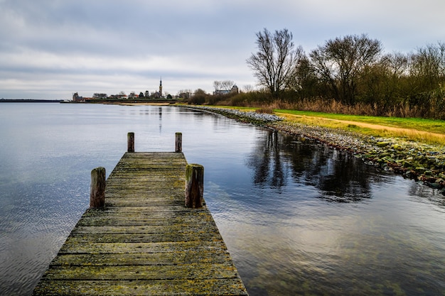 Free photo high angle shot of a wooden pier at the veerse meer veere, zealand, the netherlands