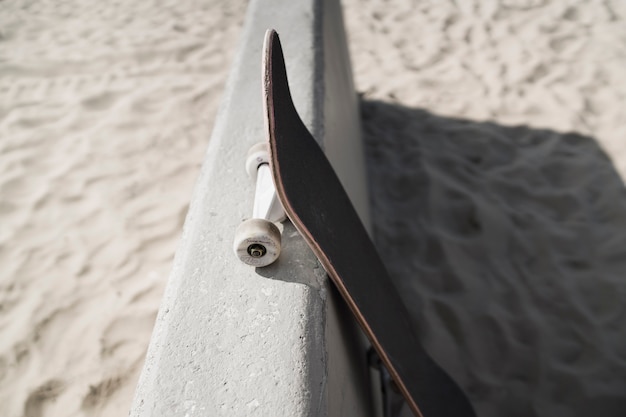 Free photo high angle skateboard at beach